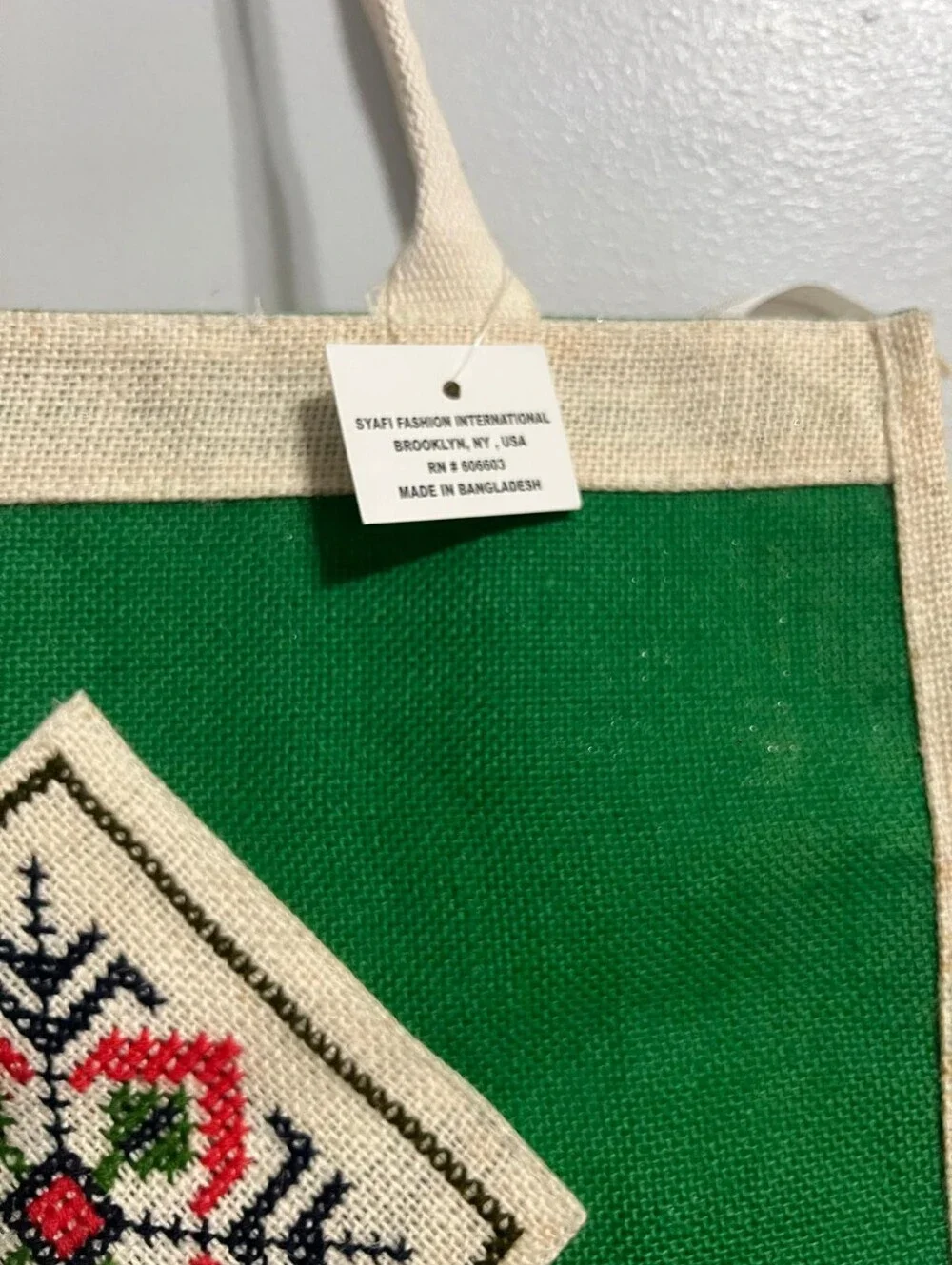 Boho-Chic Natural Jute Handbag with Cross-Stitch Embroidery.